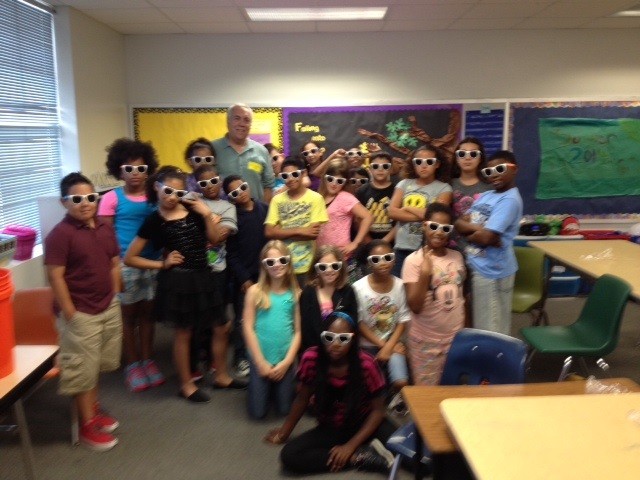 Dr. Ed Buskey takes marine science and UTMSI sunglasses to the 4th grade class of Pershing Park Elementary at Fort Hood.